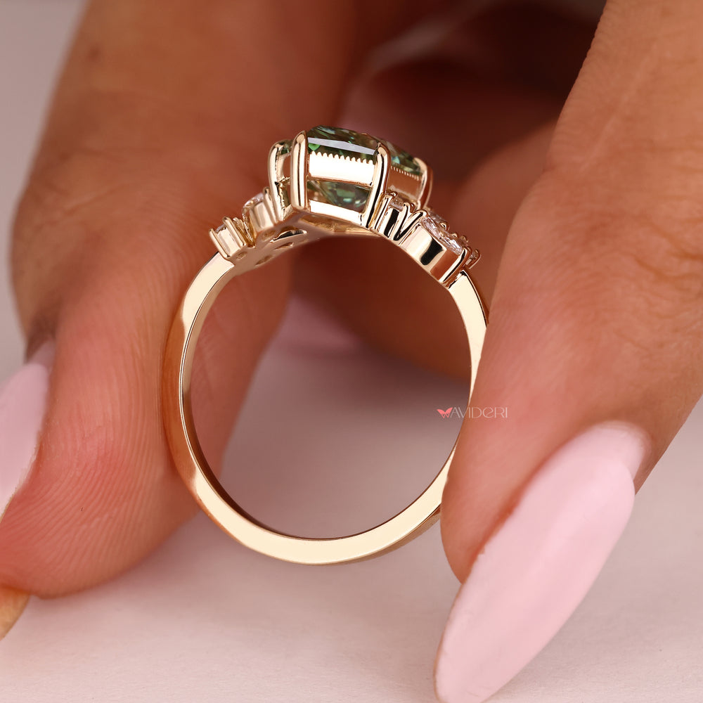 Green diamond engagement ring with marquise and round accents
