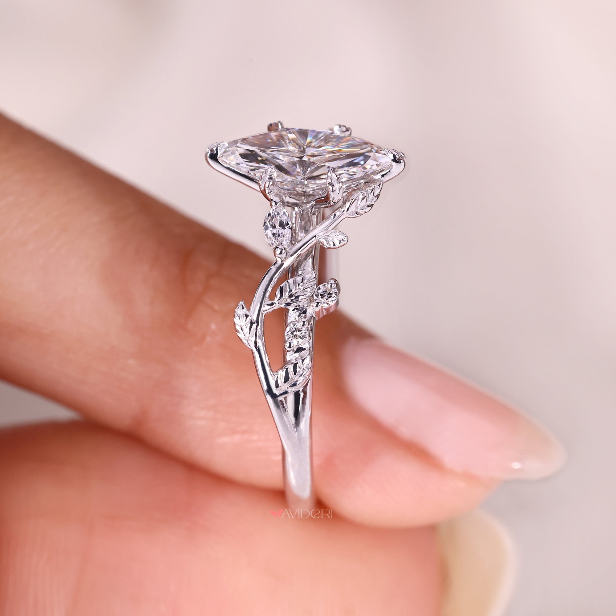 Marquise diamond ring with marquise and round side stones.
