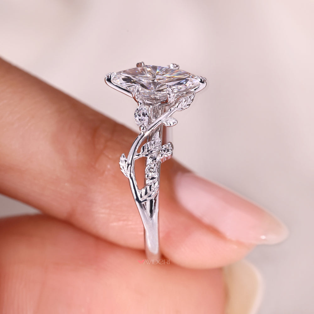 Marquise diamond ring with marquise and round side stones.
