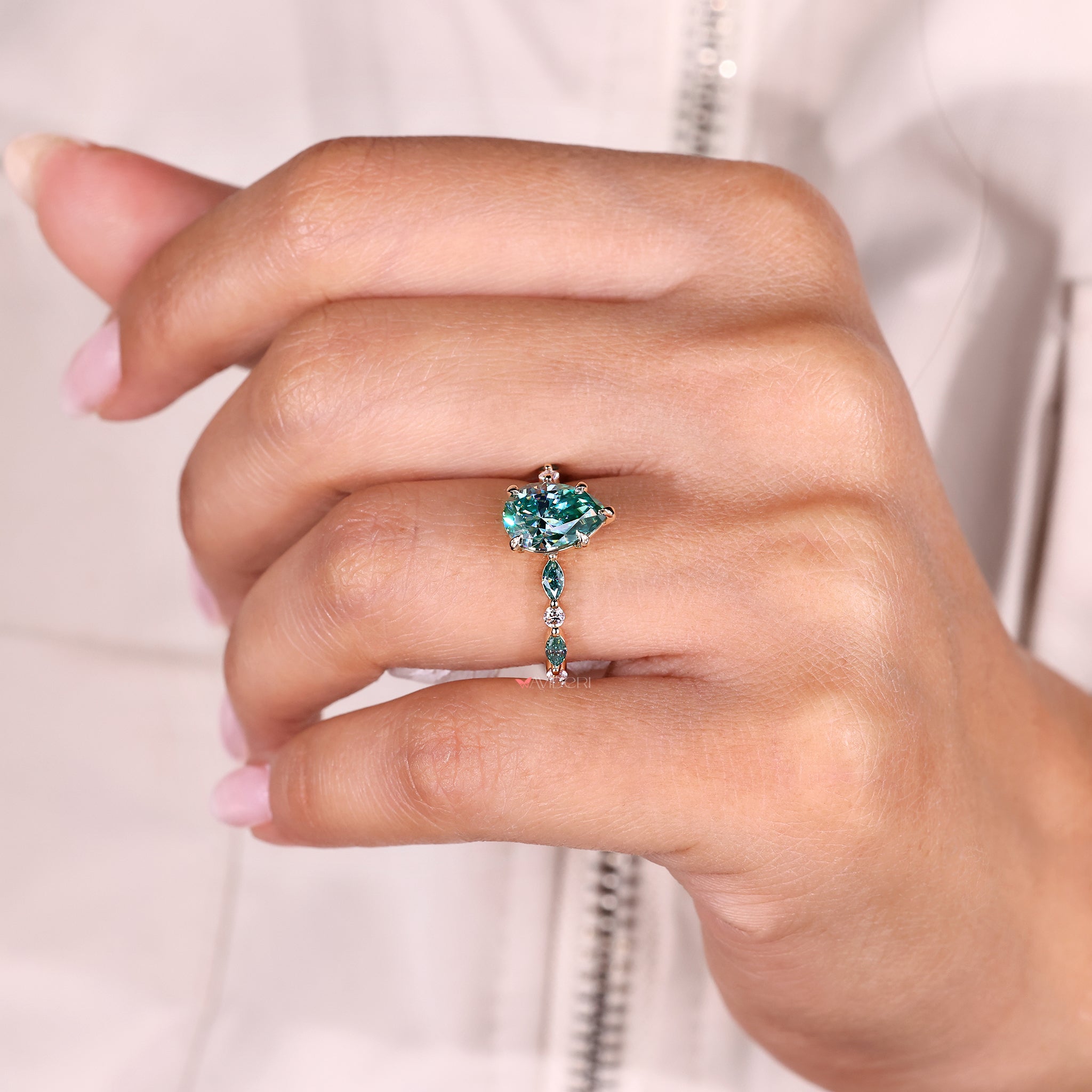 Moissanite ring with shared prong pave style.
