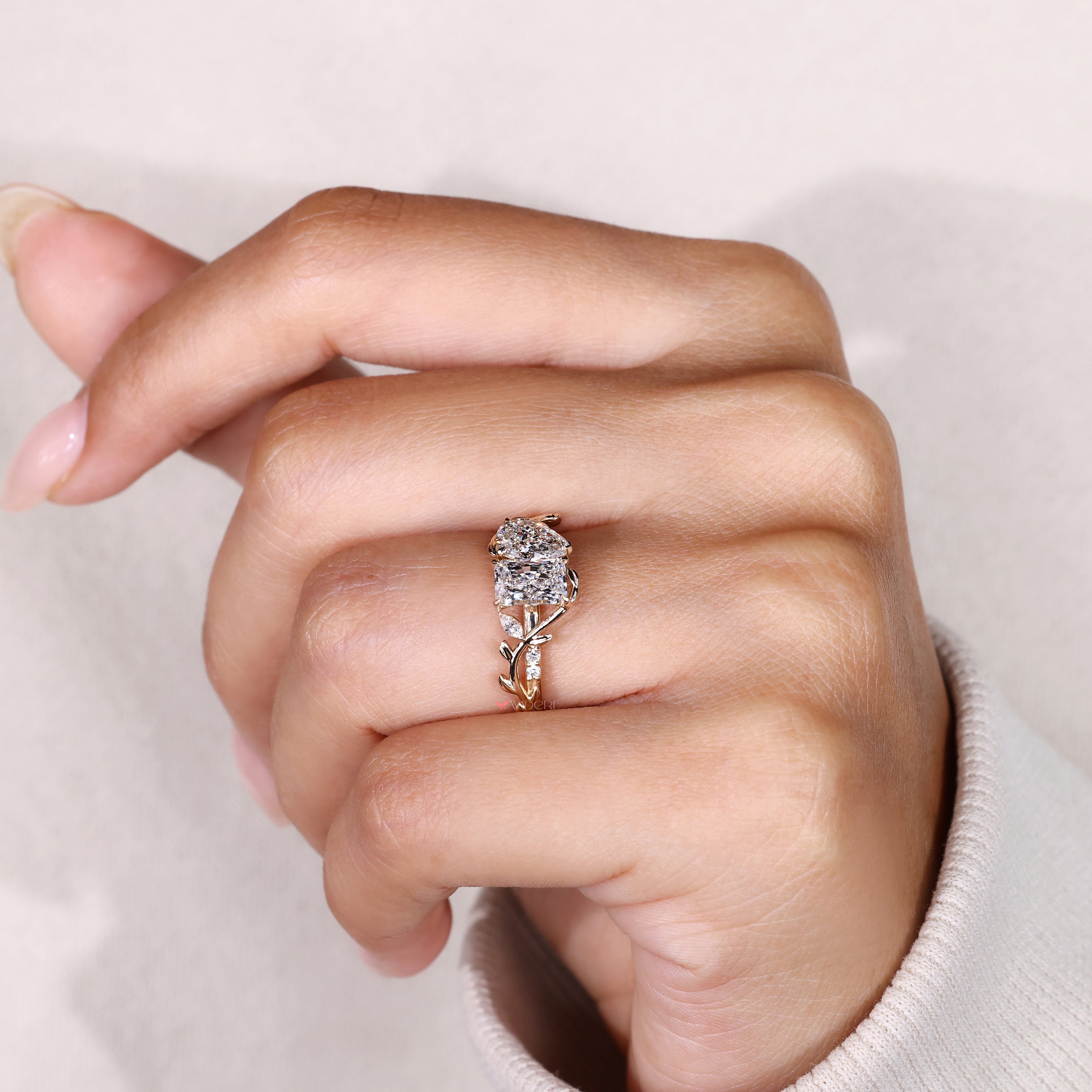 Lab grown pear and radiant cut diamond ring.
