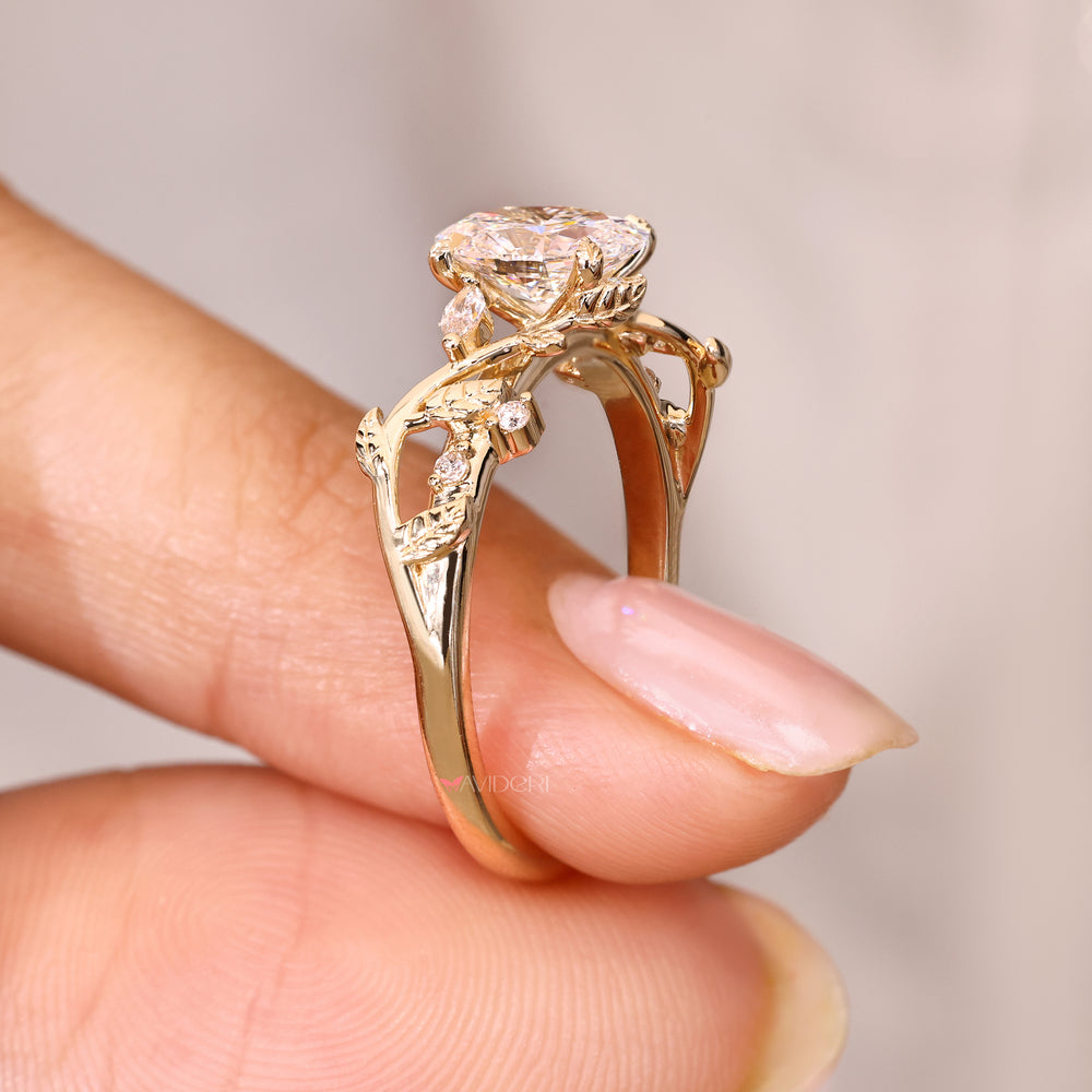 Oval diamond ring with four leaf prong setting.
