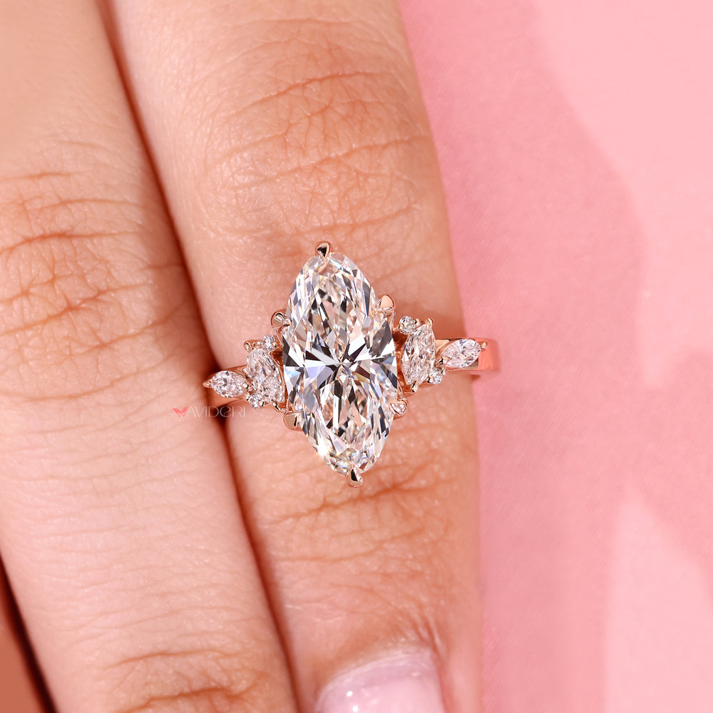 Classic moval diamond ring with side stones.
