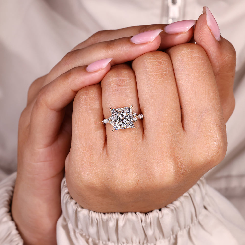 Seven stone princess cut ring with round and marquise stones.