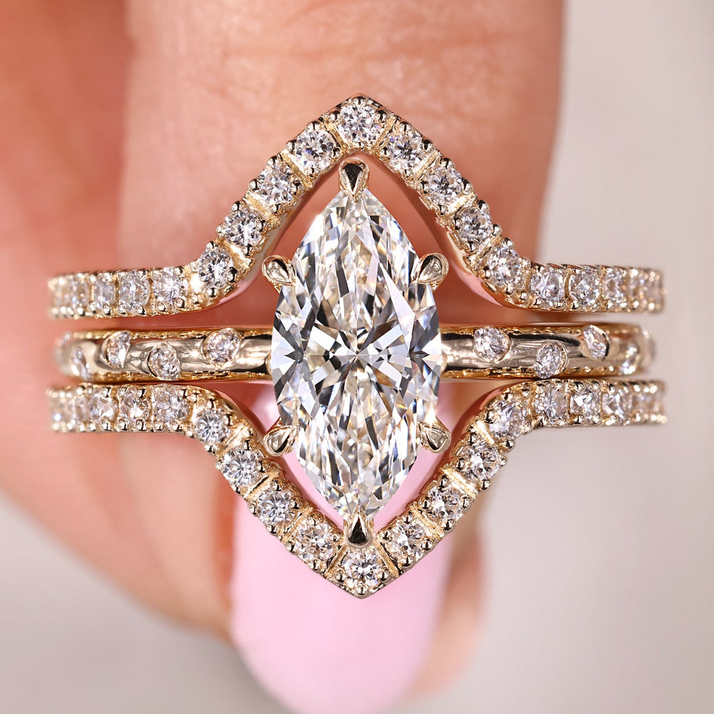 Marquise Diamond Engagement Ring With Wedding Band in cluster setting.