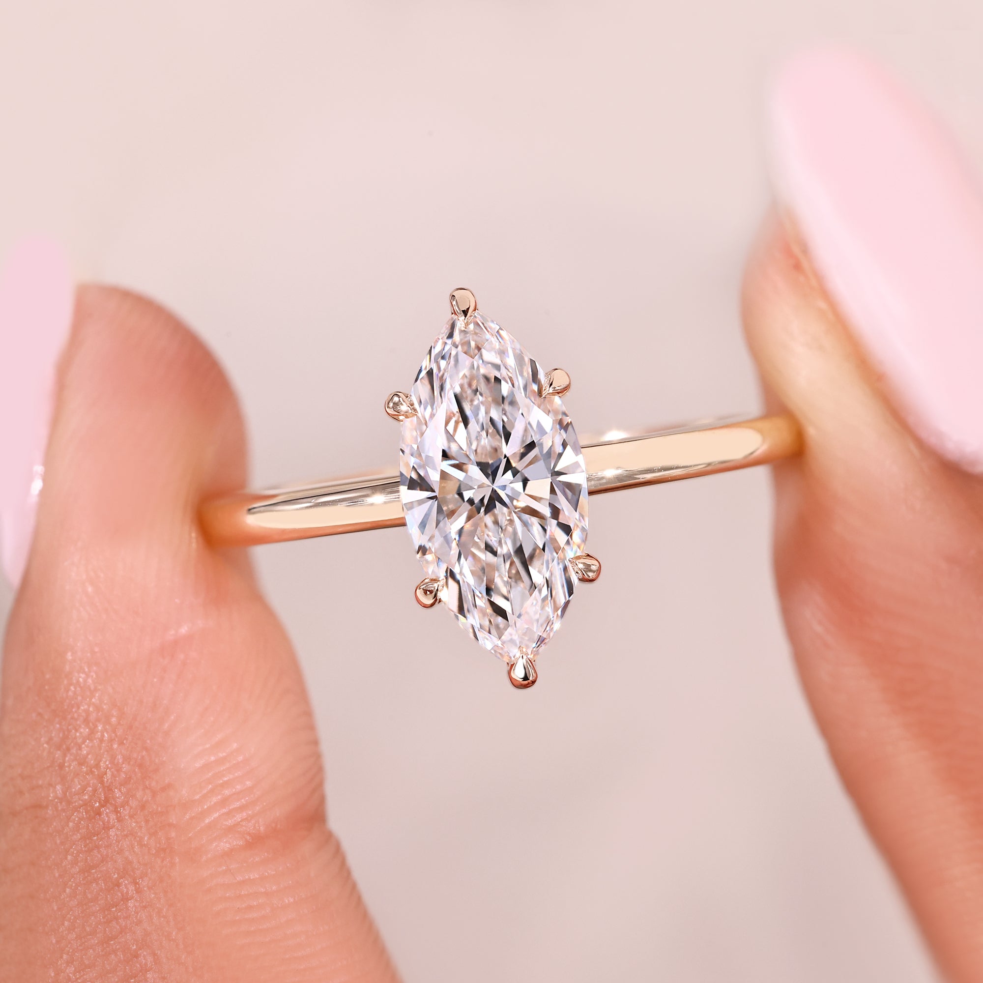 Handmade marquise cut diamond ring with claw prong design.
