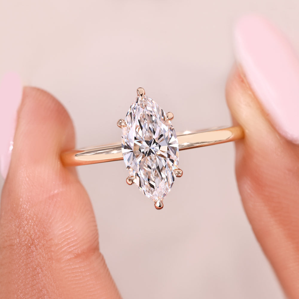 Handmade marquise cut diamond ring with claw prong design.
