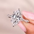 Marquise cut engagement ring with twisted pave setting.