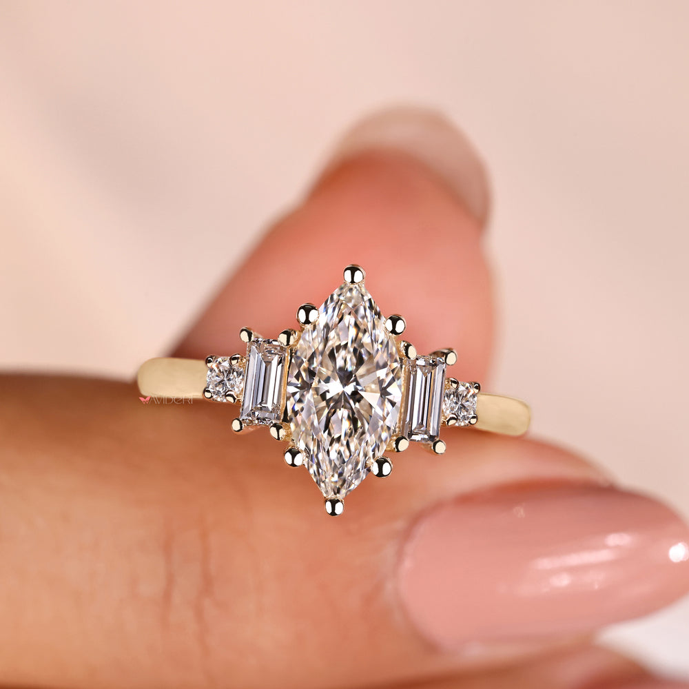 Marquise cut diamond ring with a handmade ring design.

