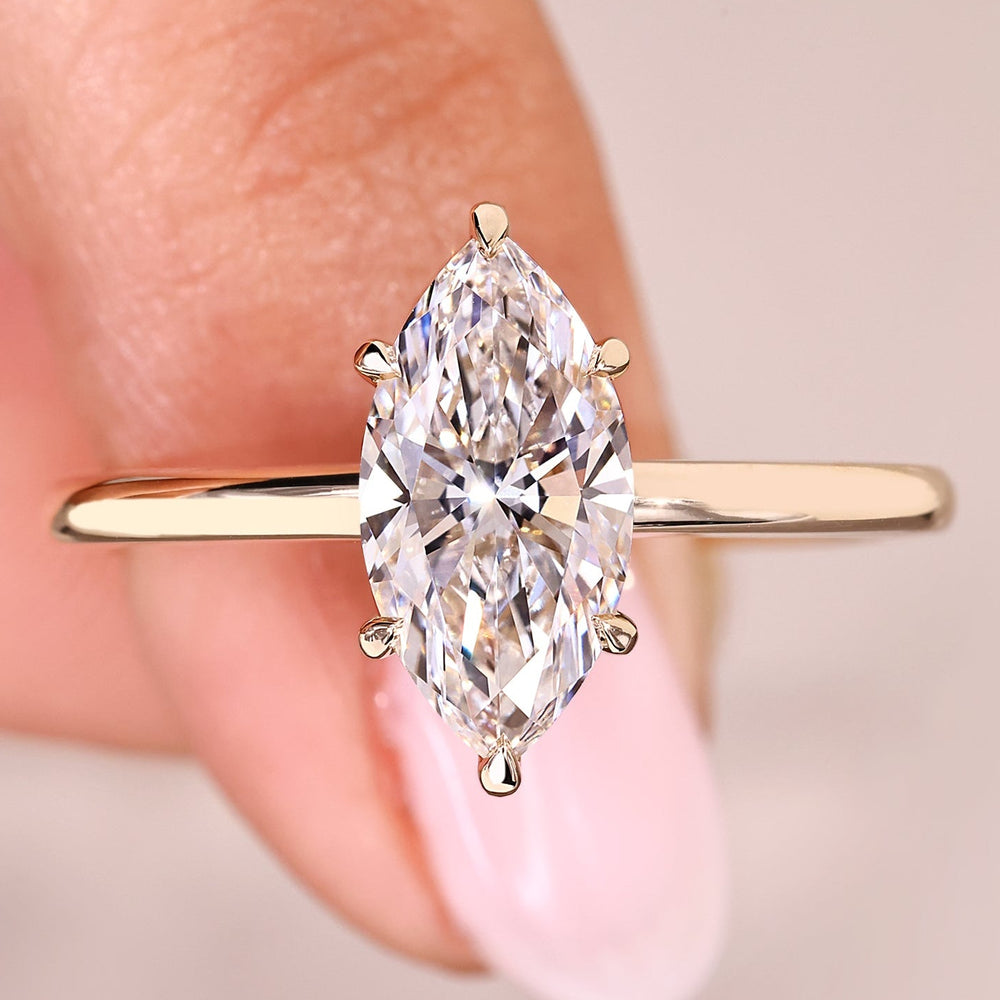 Marquise cut ring with solitaire setting and six claw prongs.
