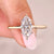 Marquise cut ring with solitaire setting and six claw prongs.
