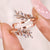 Nature inspired wedding band with a marquise cut design.