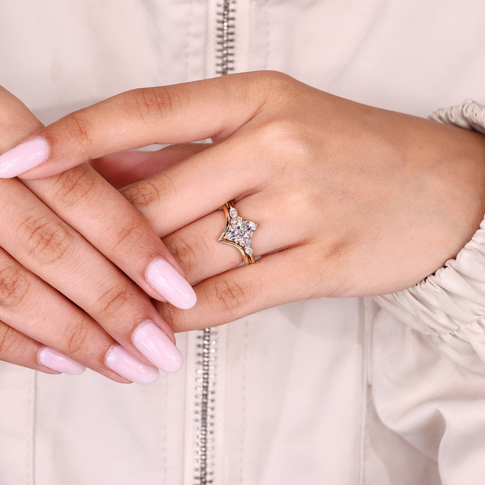Marquise diamond ring with tapered shank design.
