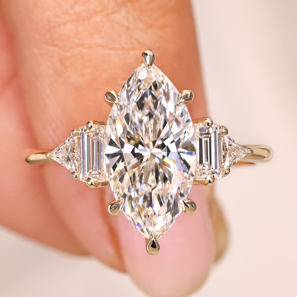 Marquise lab grown diamond ring with baguette side stones.
