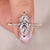 Marquise diamond engagement ring crafted with tapered shank and side diamonds.
