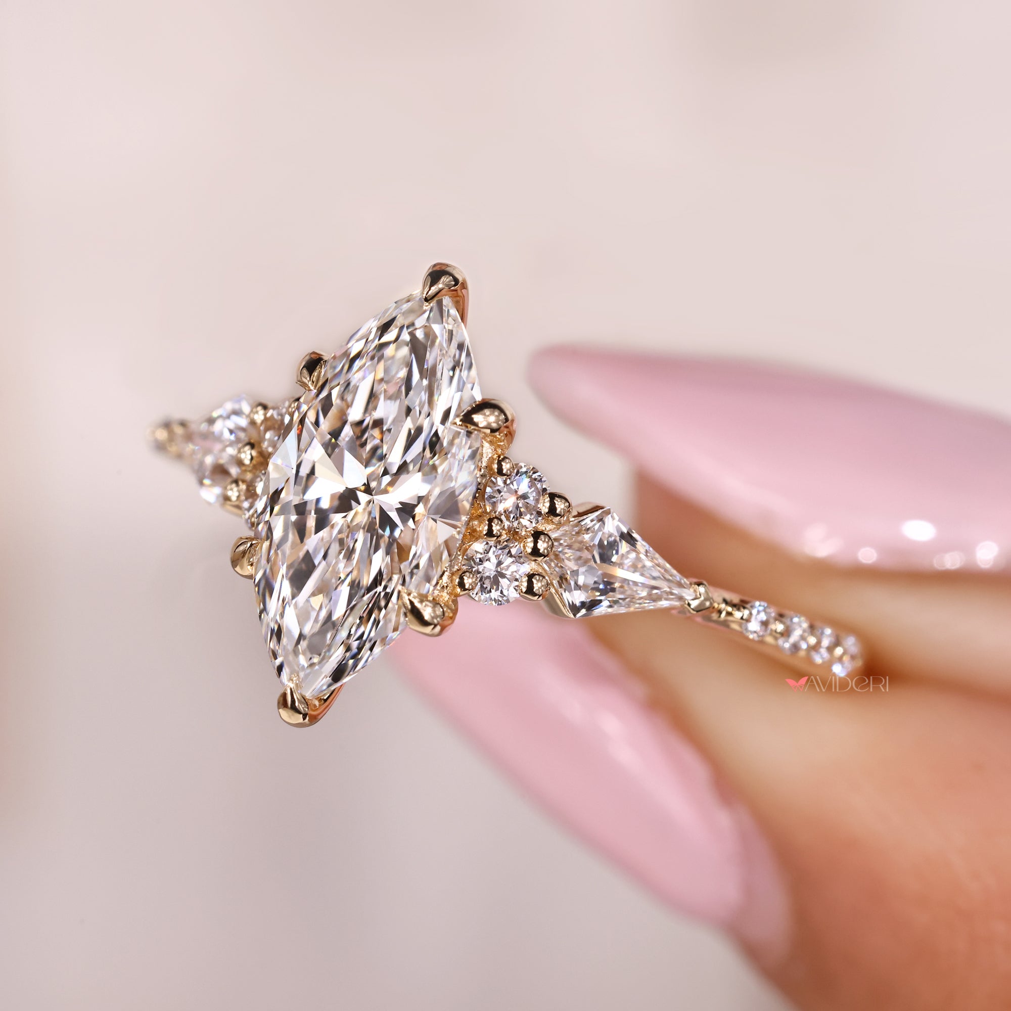 Kite side diamond ring with tapered shank design.