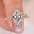 Marquise diamond engagement ring set in yellow gold, featuring a sleek design.
