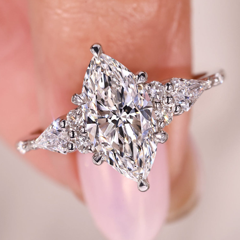 Marquise diamond ring shines with stunning shape and brilliance.