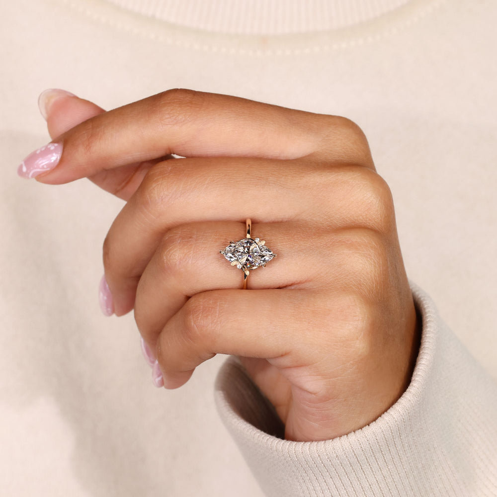 Nature inspired marquise ring with leaf style prongs.
