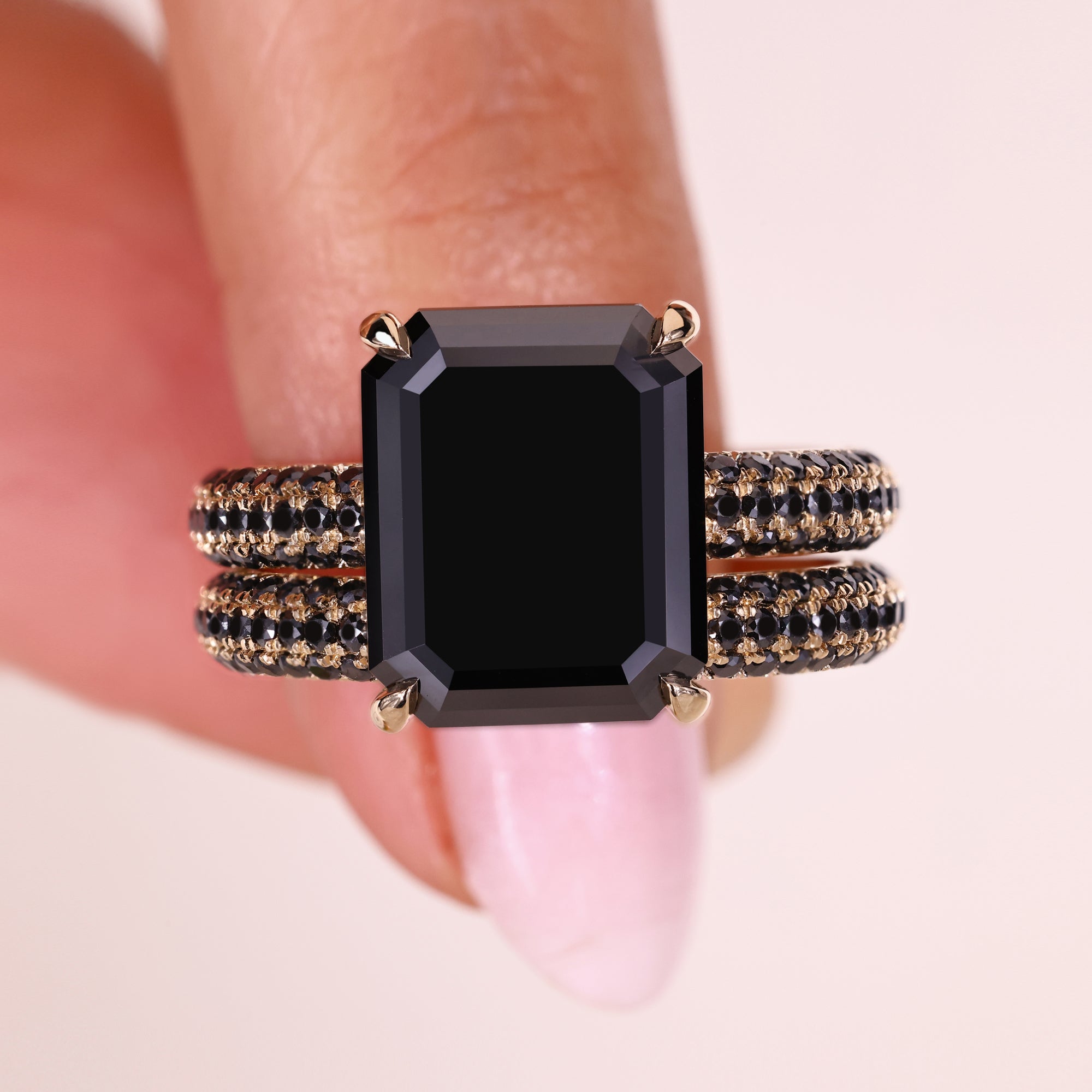 Yellow gold ring with an emerald cut moissanite center for a classic look.