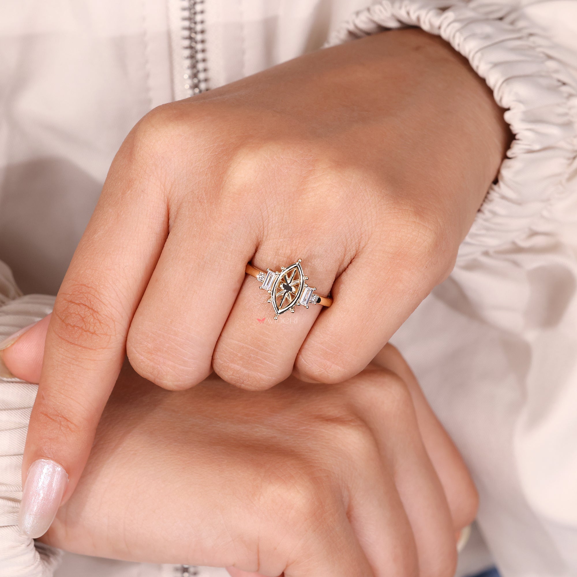 Five stone engagement ring with baguette and round side diamonds.
