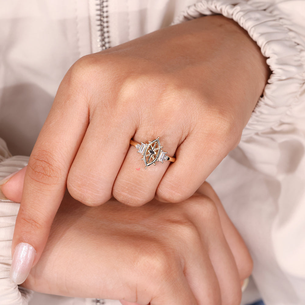 Five stone engagement ring with baguette and round side diamonds.
