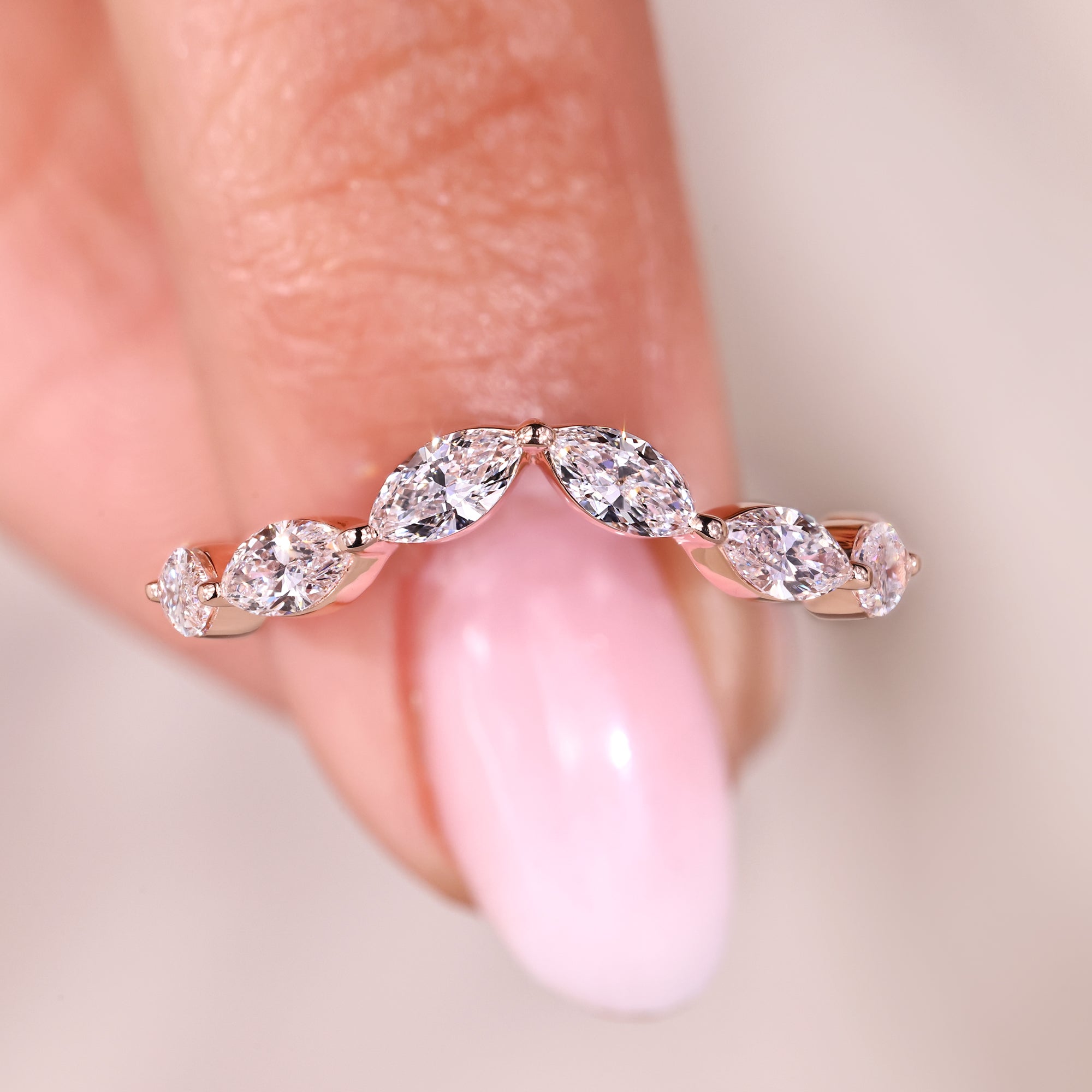 Two tone diamond wedding band in rose and white gold.

