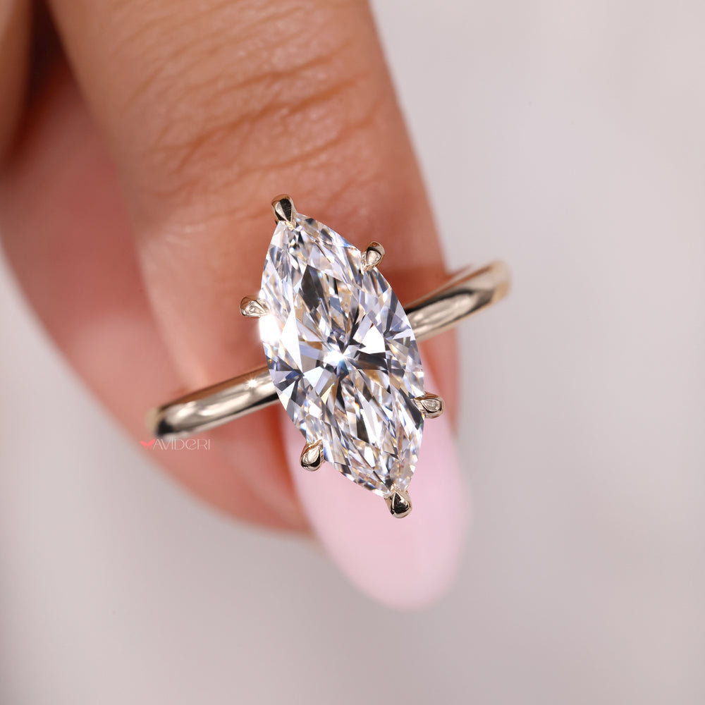 6  claw prong ring setting with a Marquise diamond for secure brilliance.
