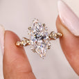 Marquise engagement ring designed with round side stones ring.