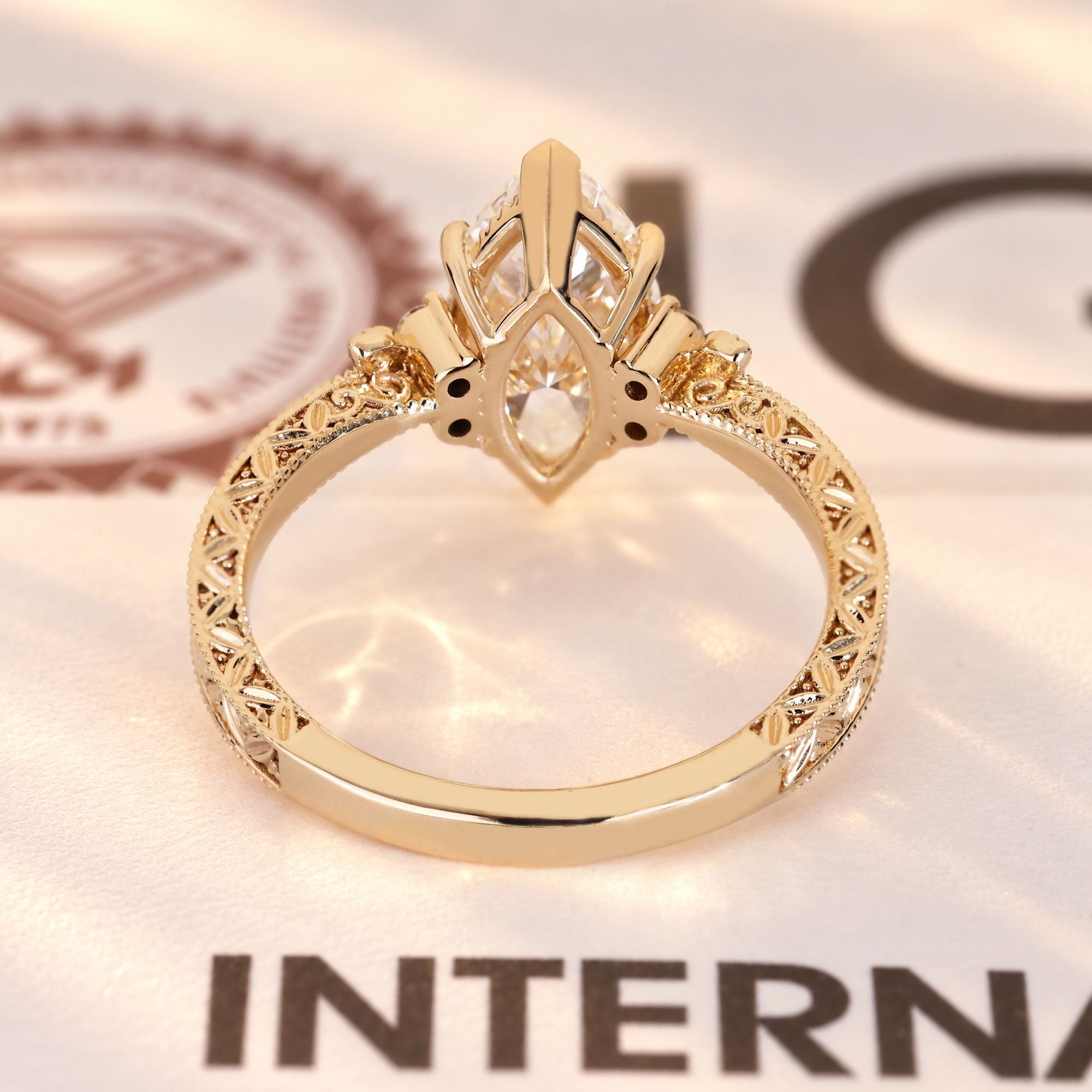Vintage marquise ring with round side diamonds.

