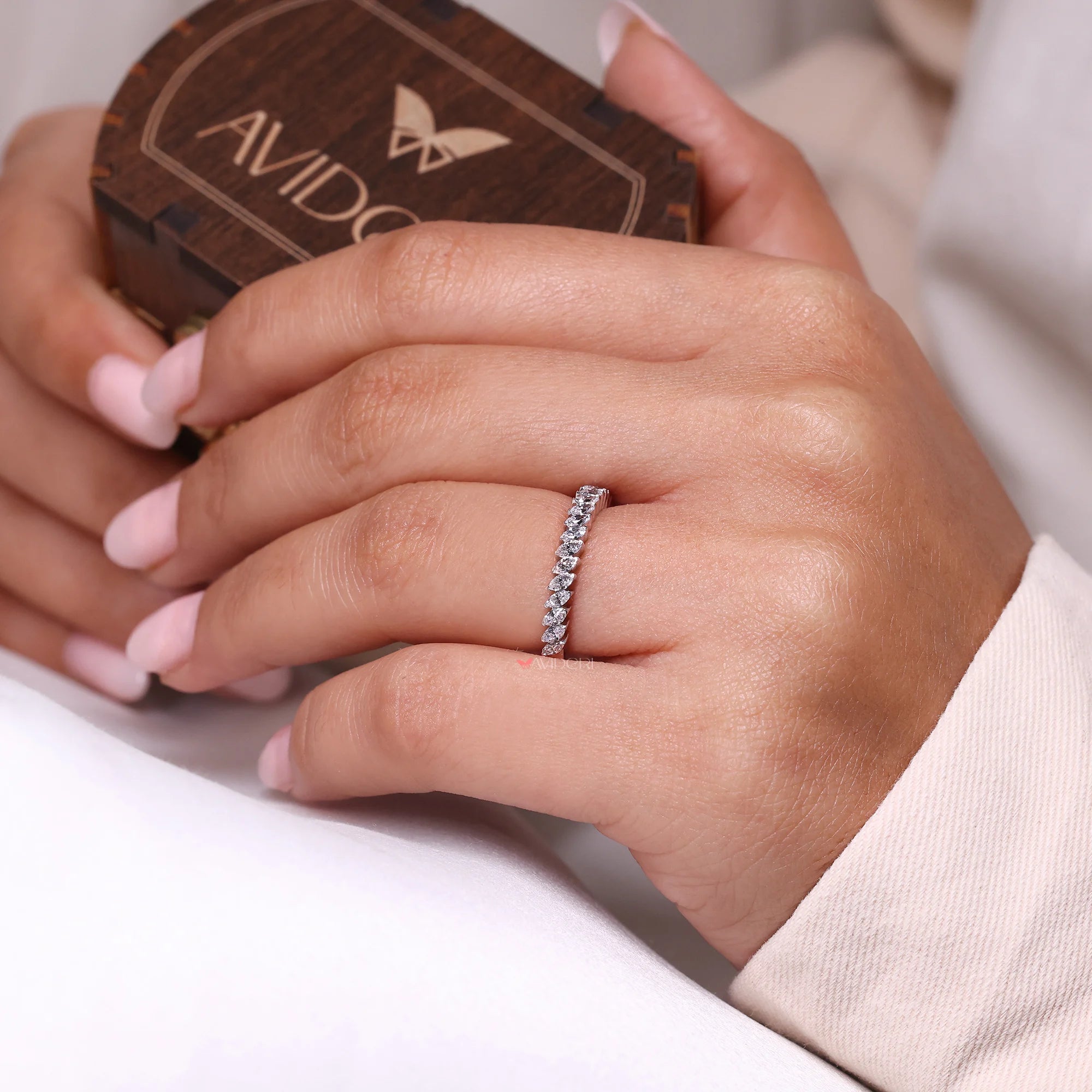 V prong setting with white gold wedding band.
