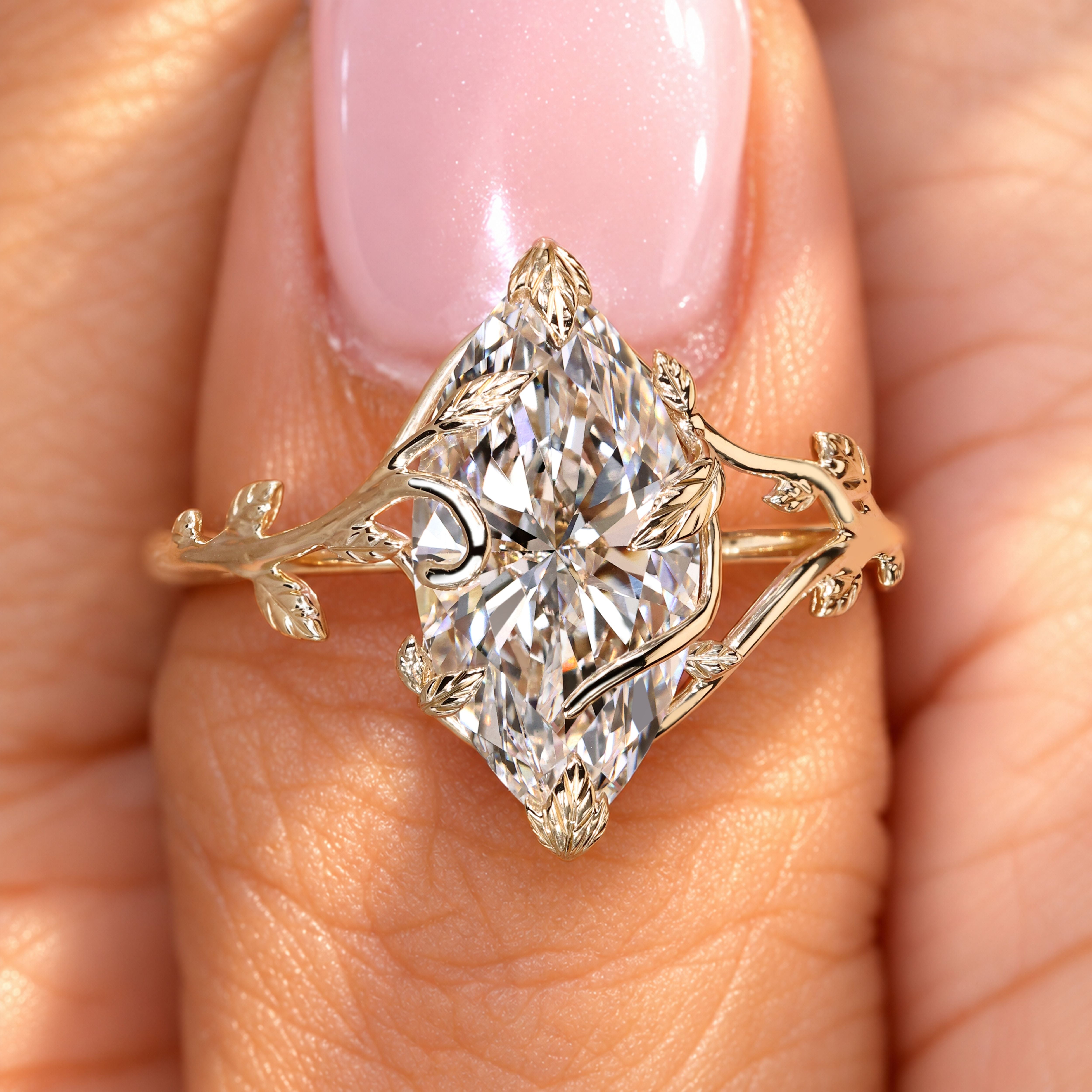 Handmade marquise diamond ring with leaf prongs.
