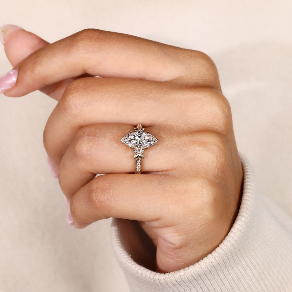 Marquise diamond ring with milgrain detailing.
