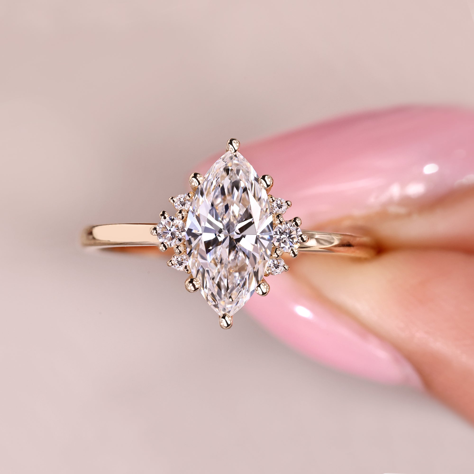 Marquise diamond ring featuring elegant muse setting.
