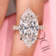 Marquise diamond engagement ring with pave setting ring.
