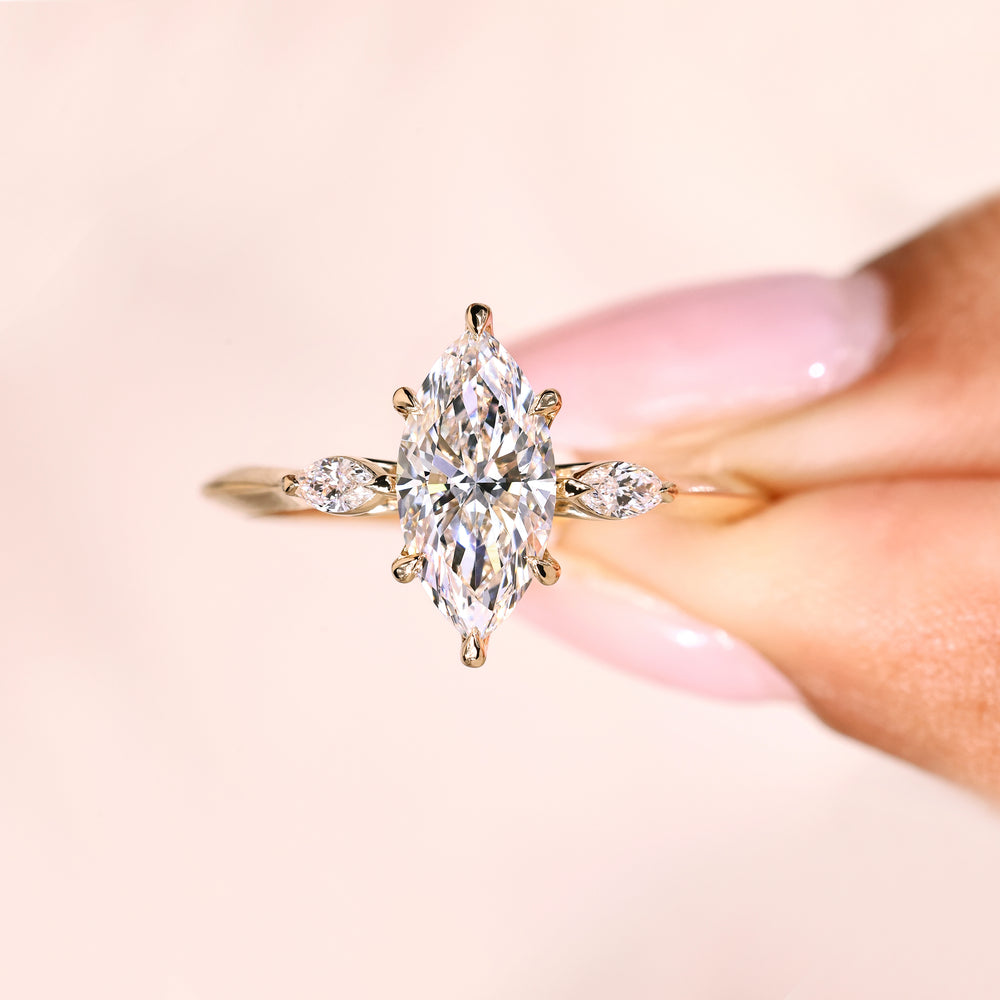 Marquise ring with tulip setting knife edge shank.
