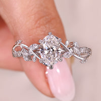 Nature Inspired Oval Cut Diamond Ring with Marquise and Round Side Stone