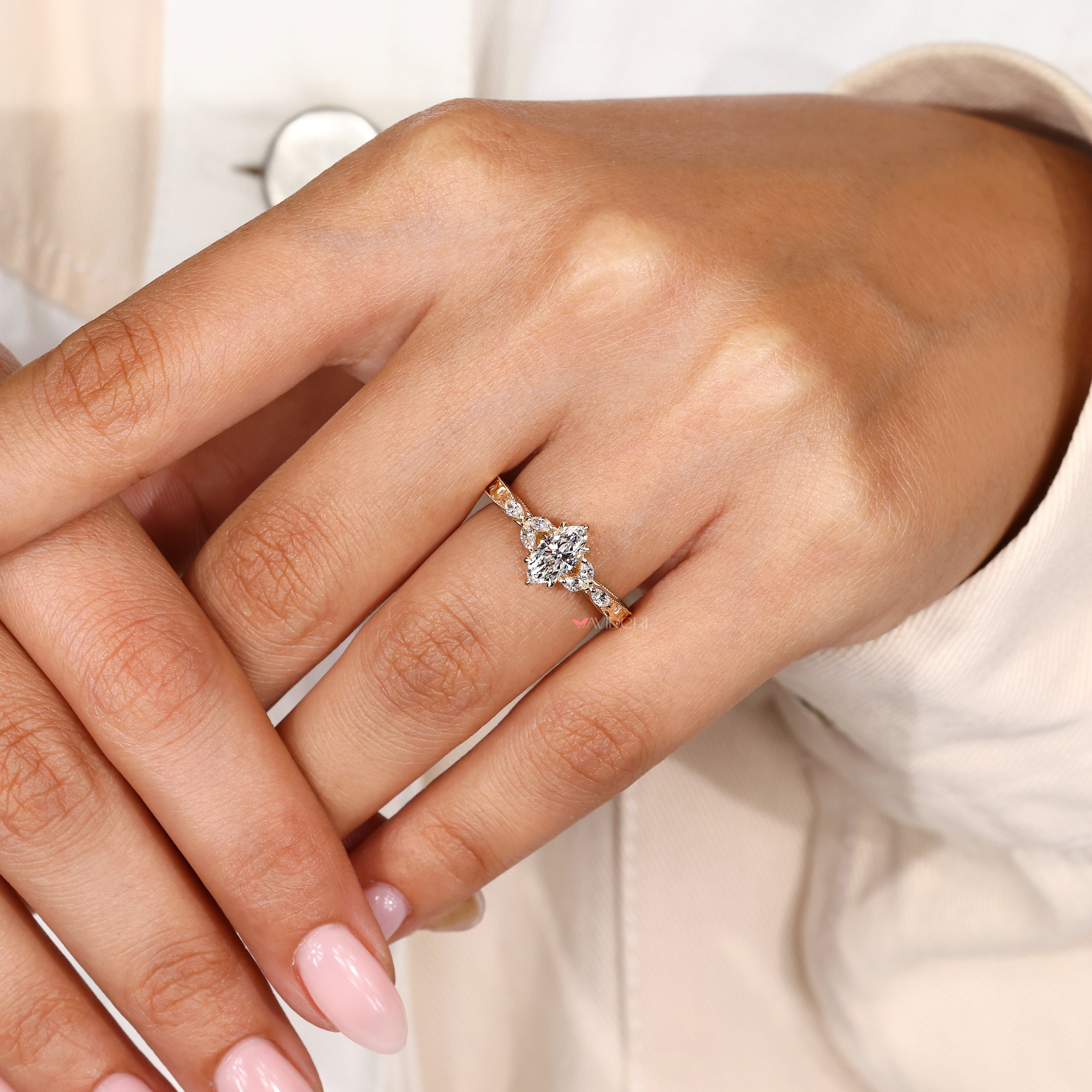 Six claw prong marquise diamond engagement ring.
