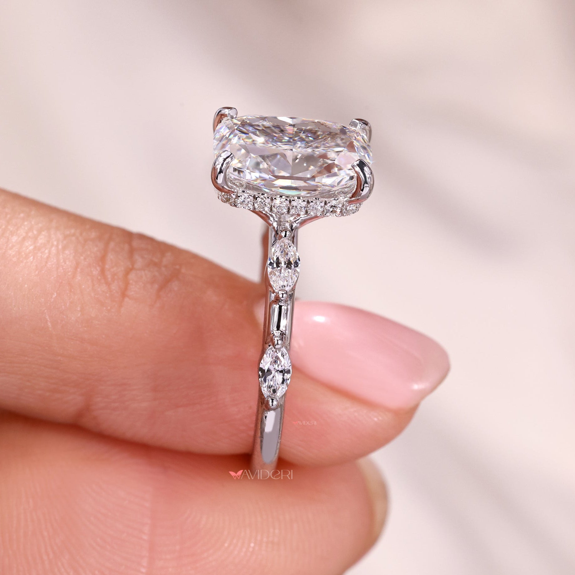 Handmade jewelry ring with an elongated cushion center.
