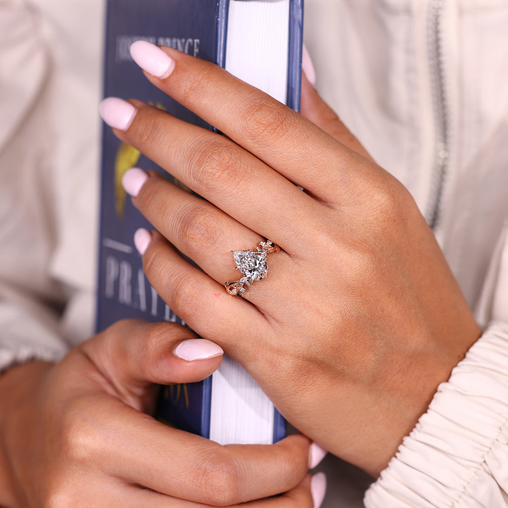 Lab grown pear diamond ring with leaf style prongs
