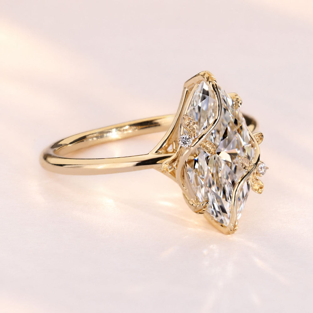 Lab grown marquise engagement ring with leaf prongs.
