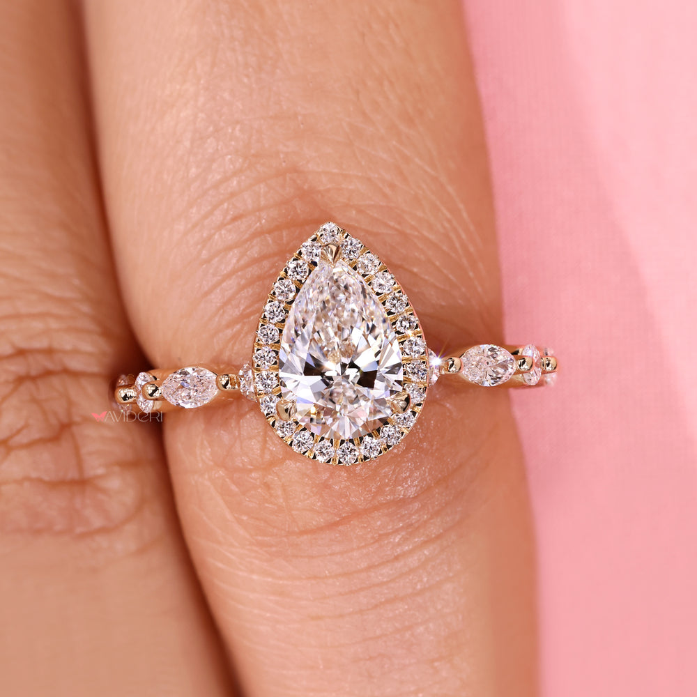 Cathedral pear diamond ring with sparkle.
