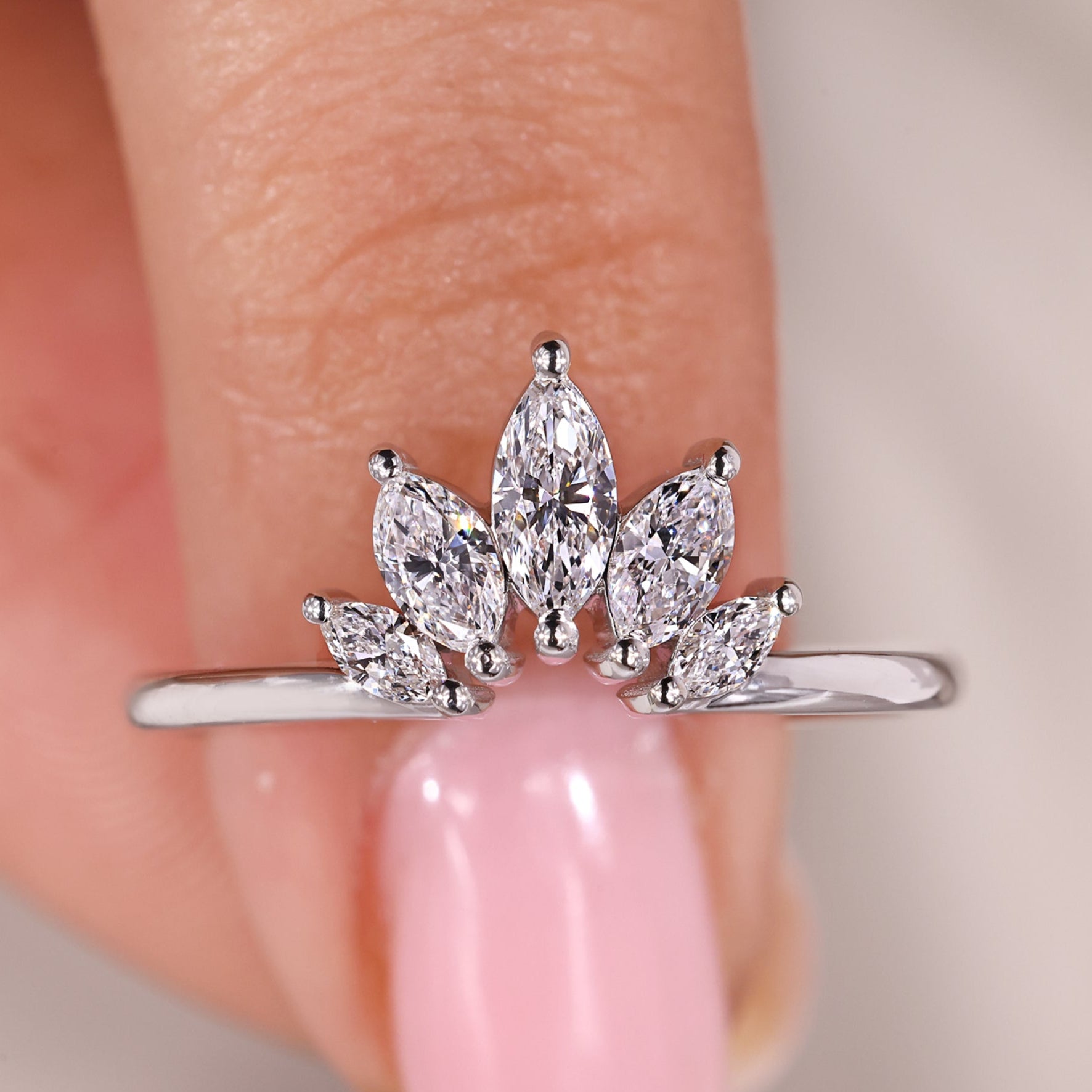 Marquise wedding band has a pointed diamond shape.