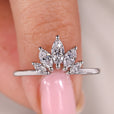Marquise wedding band has a pointed diamond shape.