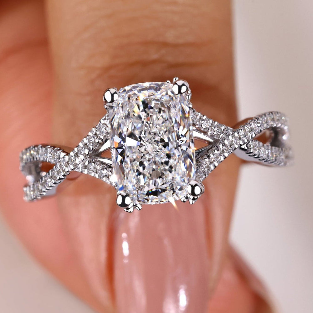 Twisted engagement ring featuring a stunning cushion cut diamond, perfect for symbolising love and elegance.
