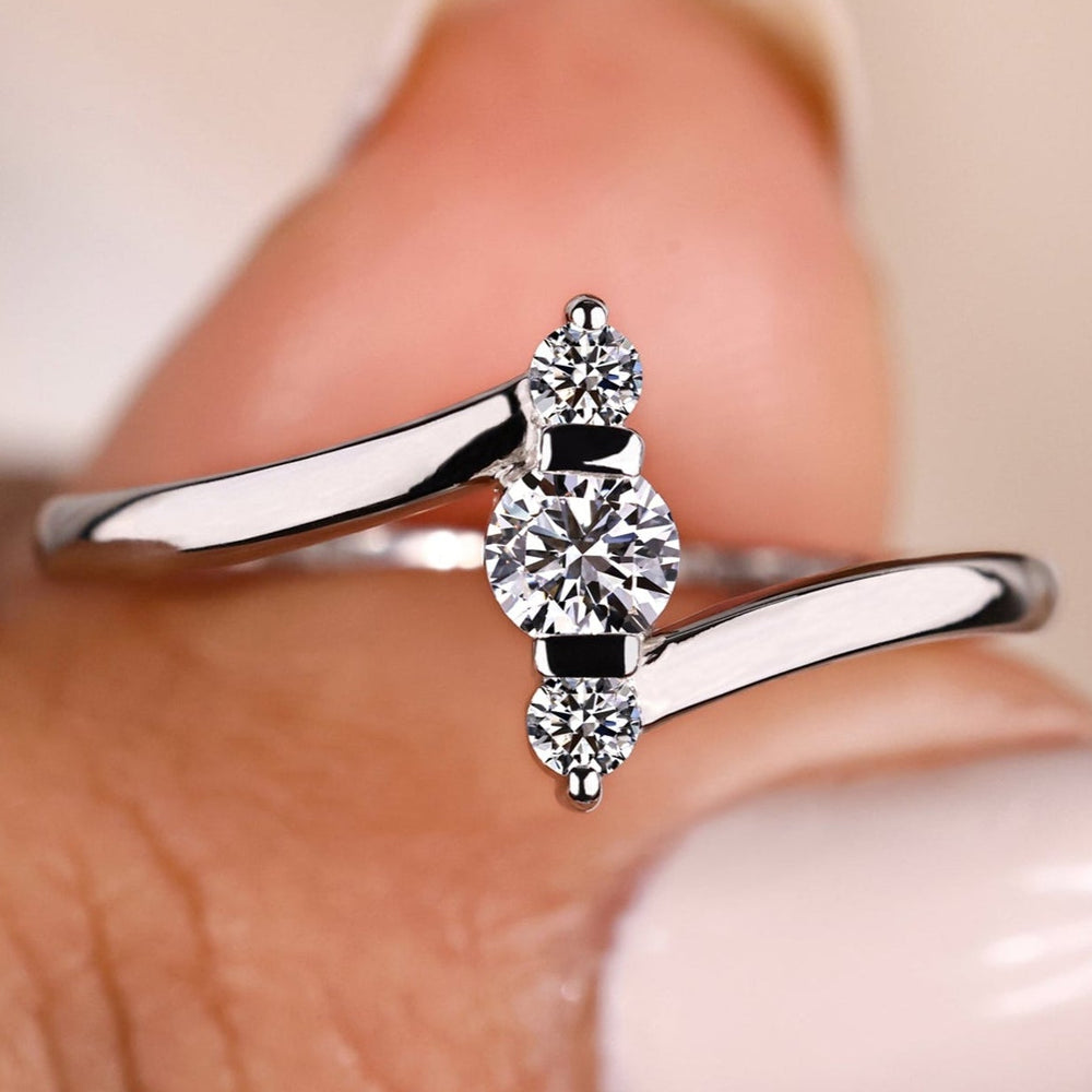 Three stone diamond engagement ring with a lab-grown diamond.

