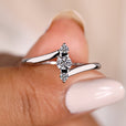 Three stone diamond engagement ring with a lab-grown diamond.
