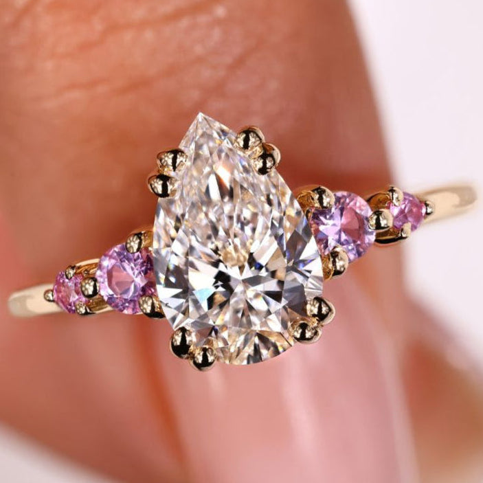 Pear-shaped engagement ring with a sparkling pear diamond, featuring a timeless and elegant design.
