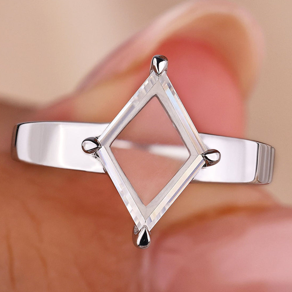 A lozenge portrait ring featuring a handmade white gold design, crafted to perfection.
