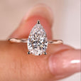Elegant pear shaped diamond ring with a timeless and sparkling design.
